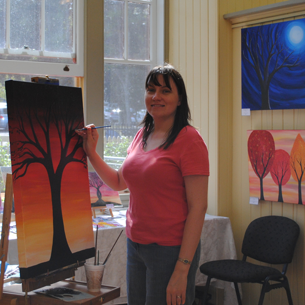 Artist Kirsten Bailey from KL Bailey Art working on a commissioned painting at Richard Randall Gallery